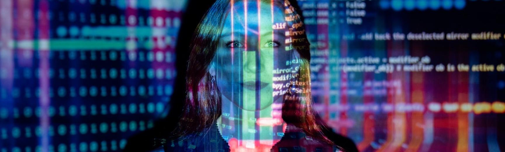 Photo of woman with projected code by Pexels thisisengineering
